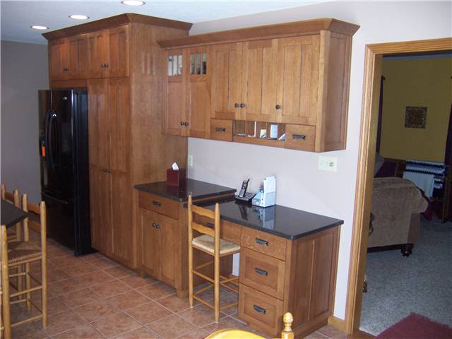 Quartersawn white oak cabinets - Flat panel doors - Full overlay style - Quartz countertops